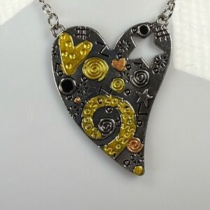 Silver and Gold Heart Pendant Necklace with Artistic Swirls
